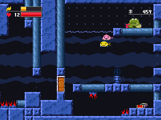 Image depicting a screenshot of Rockfish 2011. On a ledge above the surface of the water is a frog merchant. Below the surface of the water is a room containing a yellow fish with blue fins, and a pink fish with darker pink fins. The room has an open exit to the right, and a blocked exit to the left. The floor of the room has a save point in the middle and a gap leading to a below-ground compartment. The below-ground compartment contains two sets of spikes and an open treasure chest.